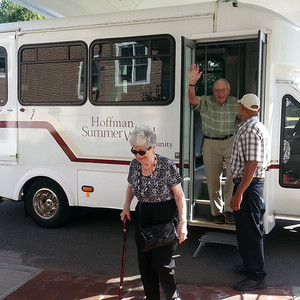 Bette and Eb getting off bus